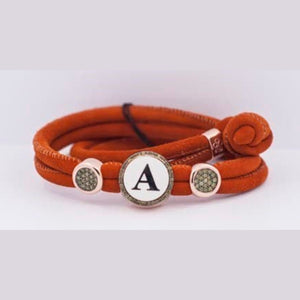 330M-A BRACCIALE LETTERA M CAMOSCIO ARANCIO